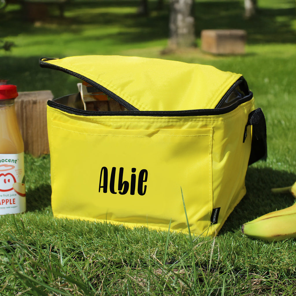 Yellow bag with 'Albie' branding on grass