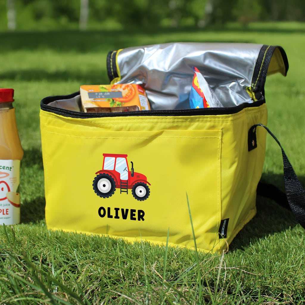Yellow cooler bag with a red tractor design and 'OLIVER' text on grass