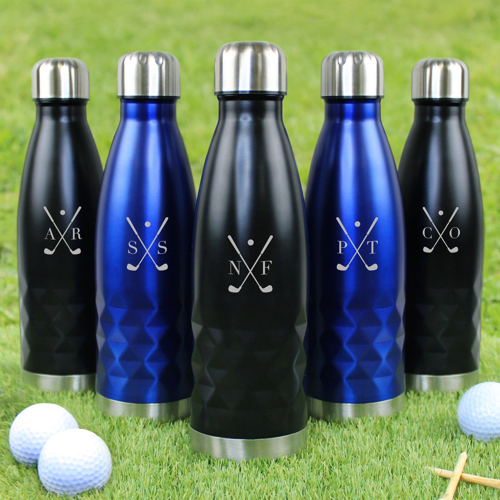 Set of black and blue water bottles with golf-themed designs on a grassy background.