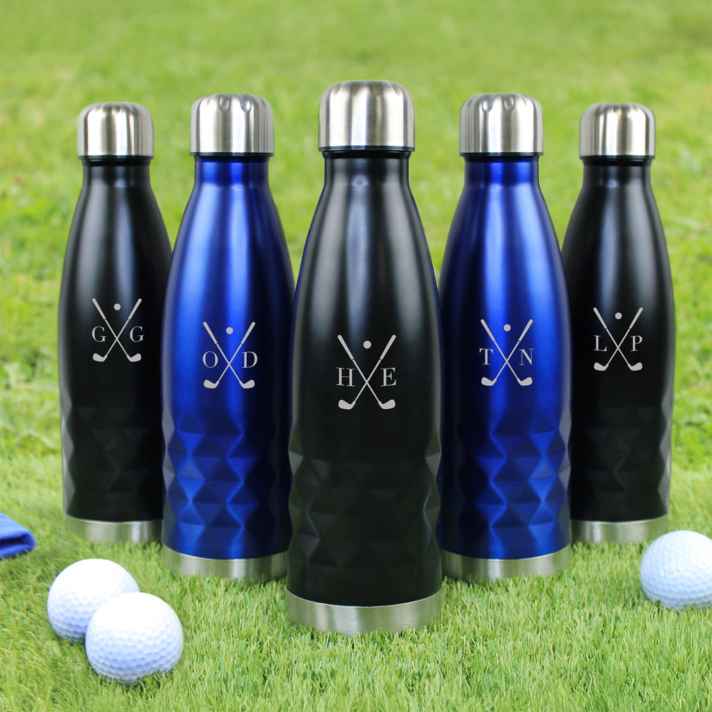 Set of insulated bottles with golf-themed designs on a grass background