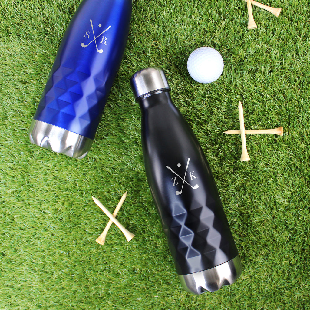 Two water bottles with golf-themed designs on a grass background with golf balls and tees.