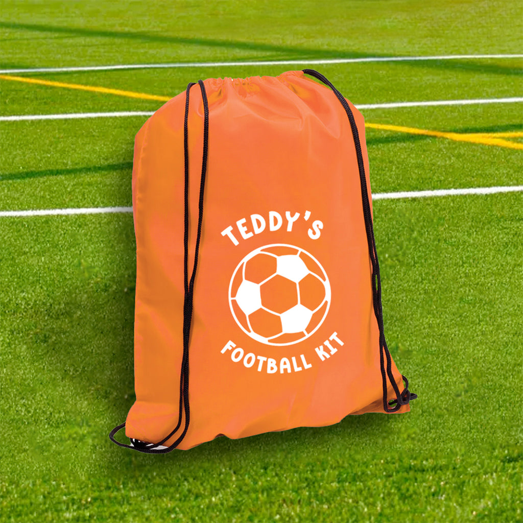 Orange drawstring bag with a soccer ball design and text on a grass field