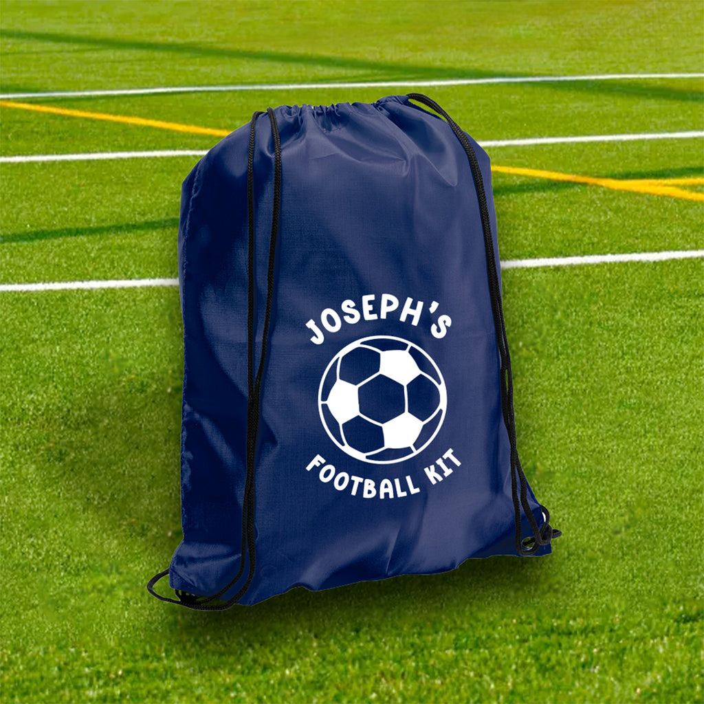 Blue drawstring bag with 'Joseph's Football Kit' on a grass field