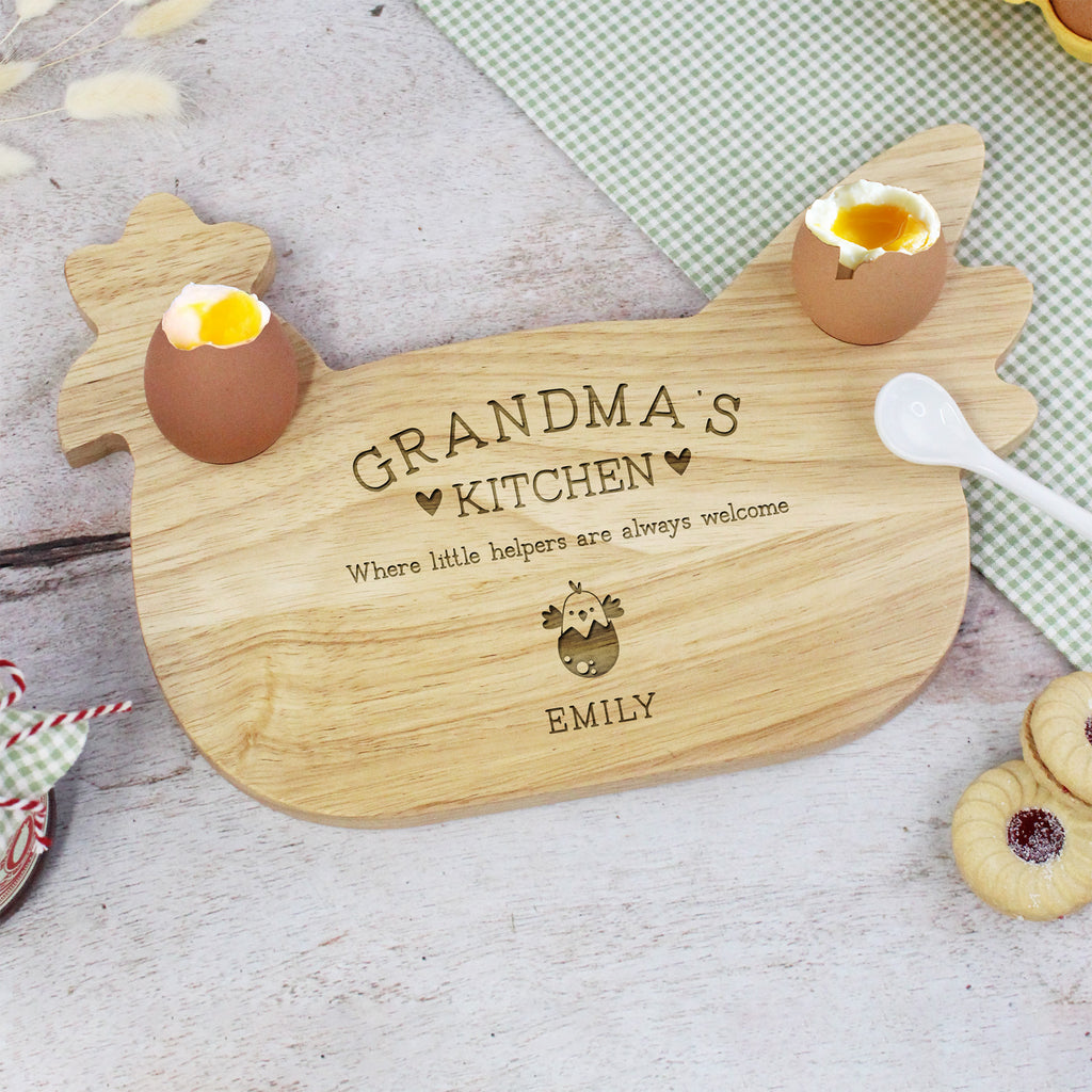 Wooden cutting board with 'Grandma's Kitchen' engraving on a light surface.