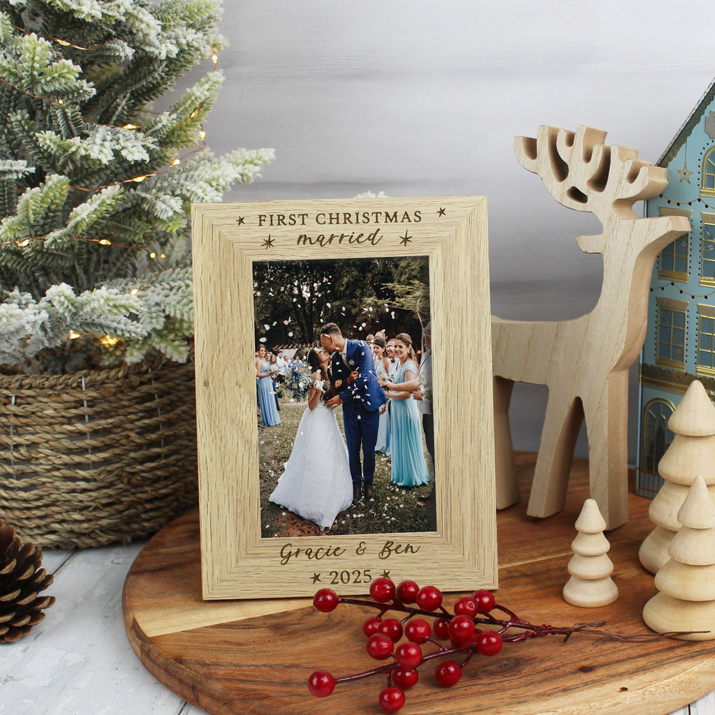 Wooden photo frame with a Christmas-themed message, surrounded by festive decorations.