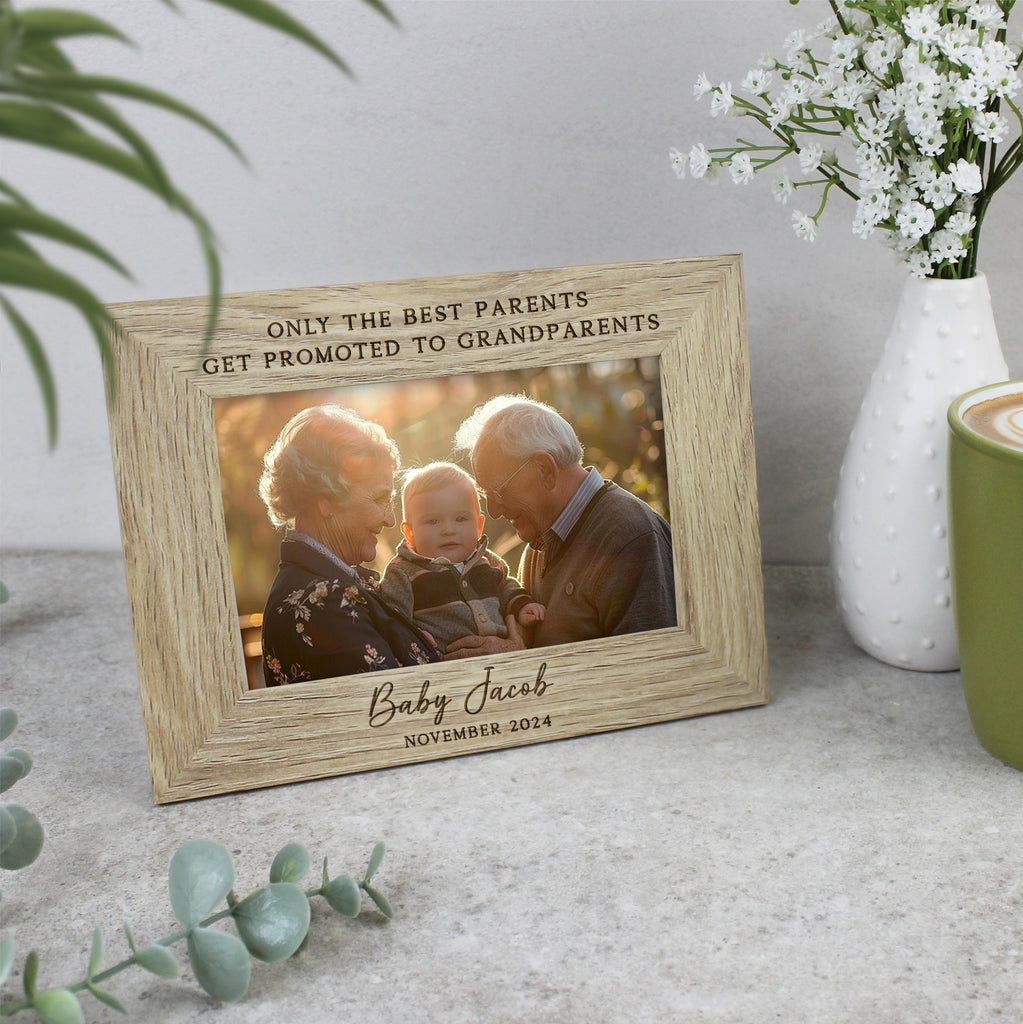 Personalized photo frame with engraved text on a surface with decorative elements.