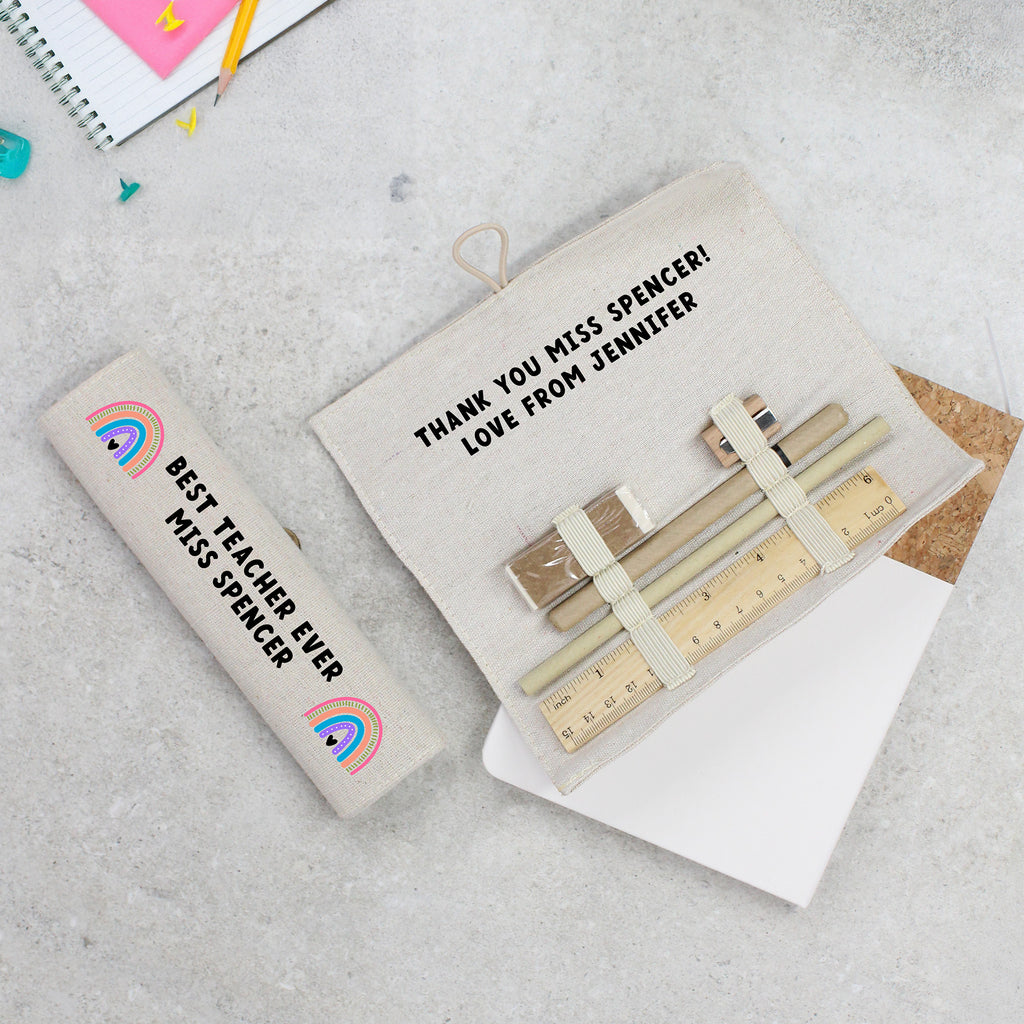 Personalized teacher gift set with stationery items on a textured surface