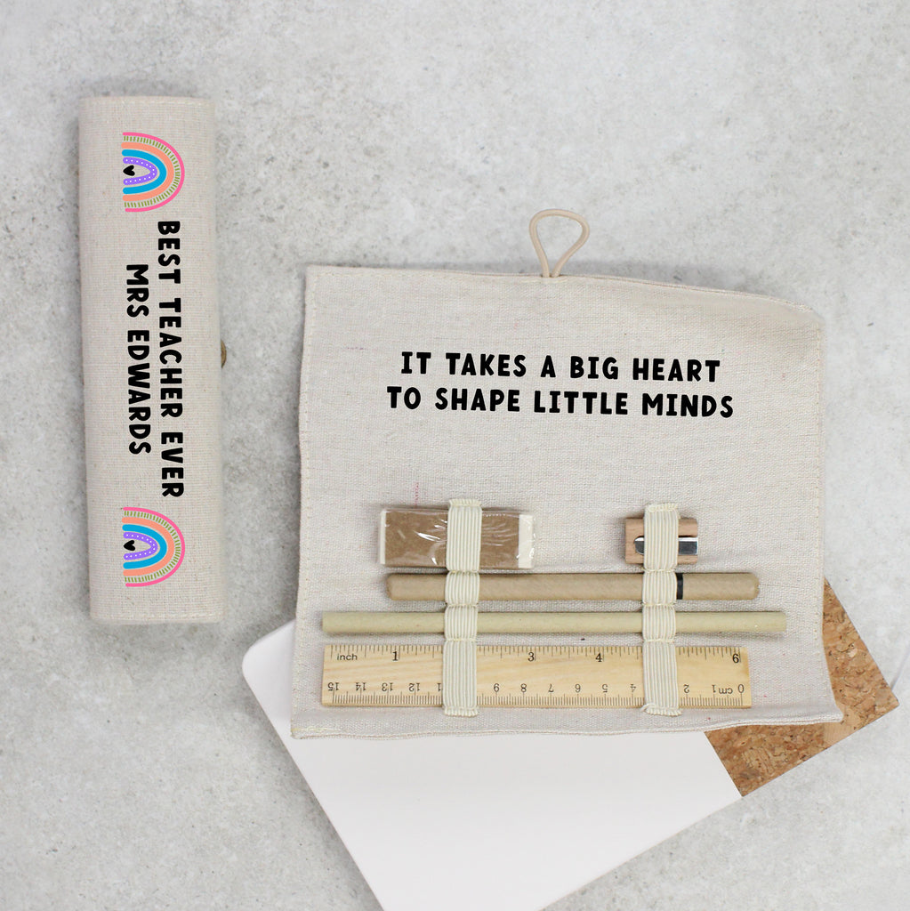 Teacher appreciation gift set with notebook, pouch, and stationery items on a textured surface