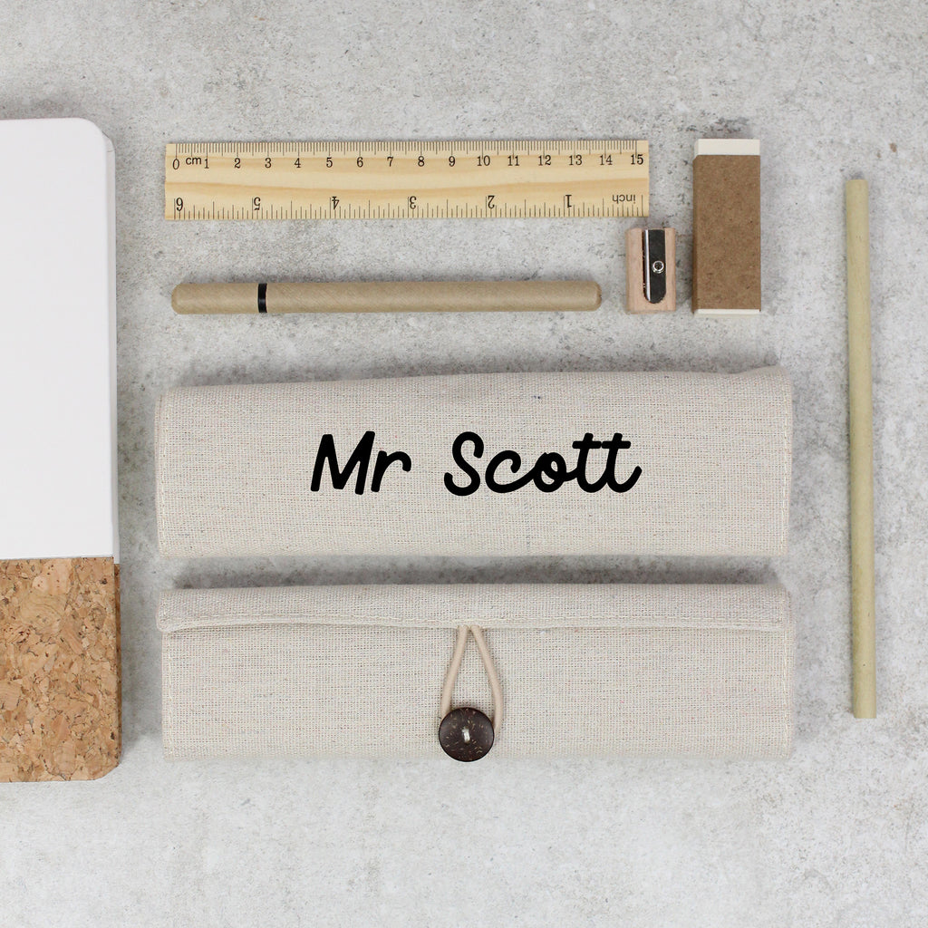 Stationery items including a pencil, ruler, and eraser on a concrete surface with 'Mr Scott' branding.