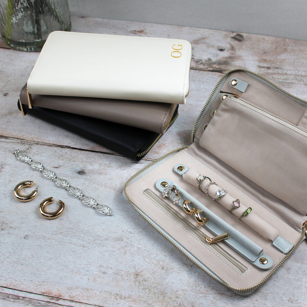 Jewelry organizer with jewelry on a wooden surface