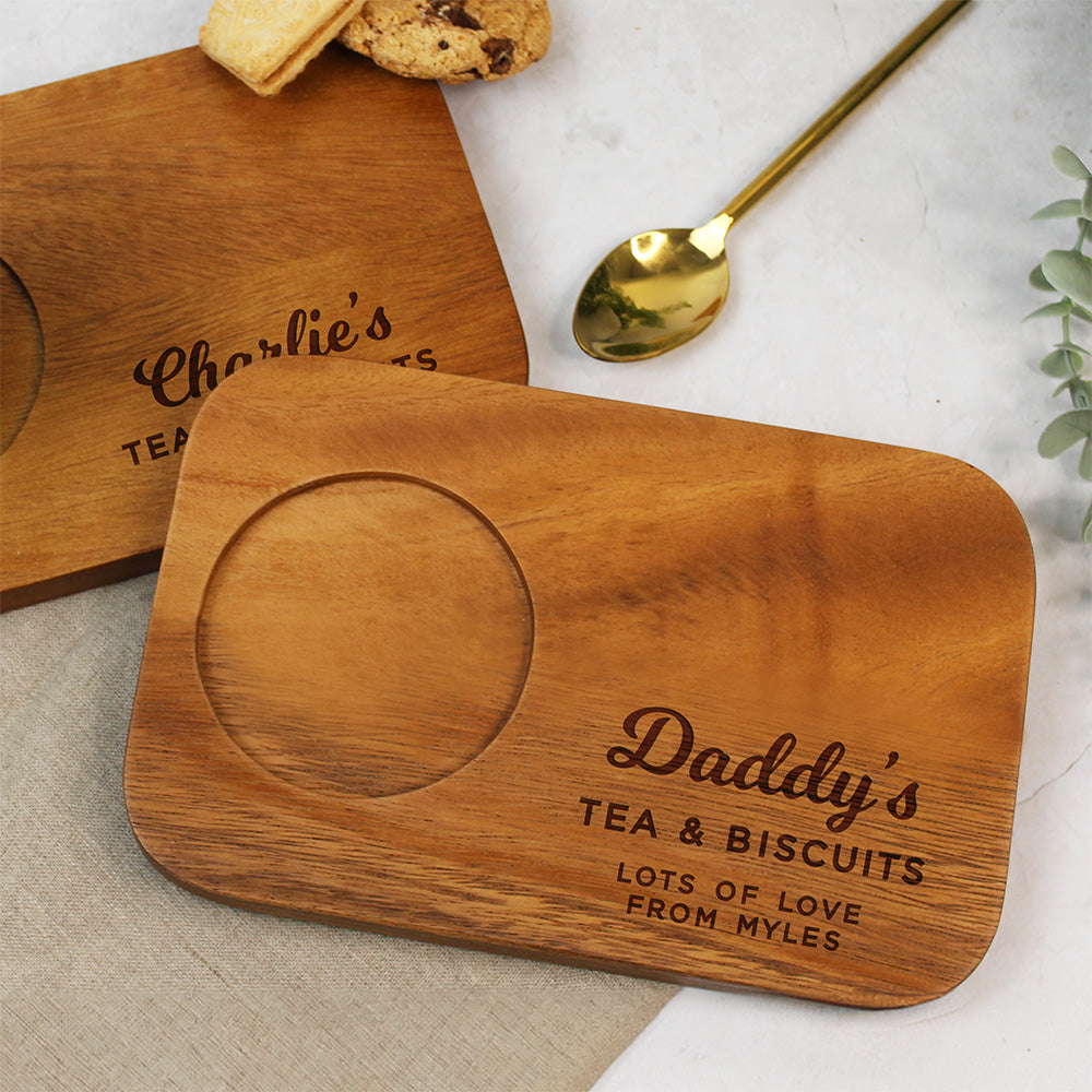 Wooden coaster with engraved text on a marble surface