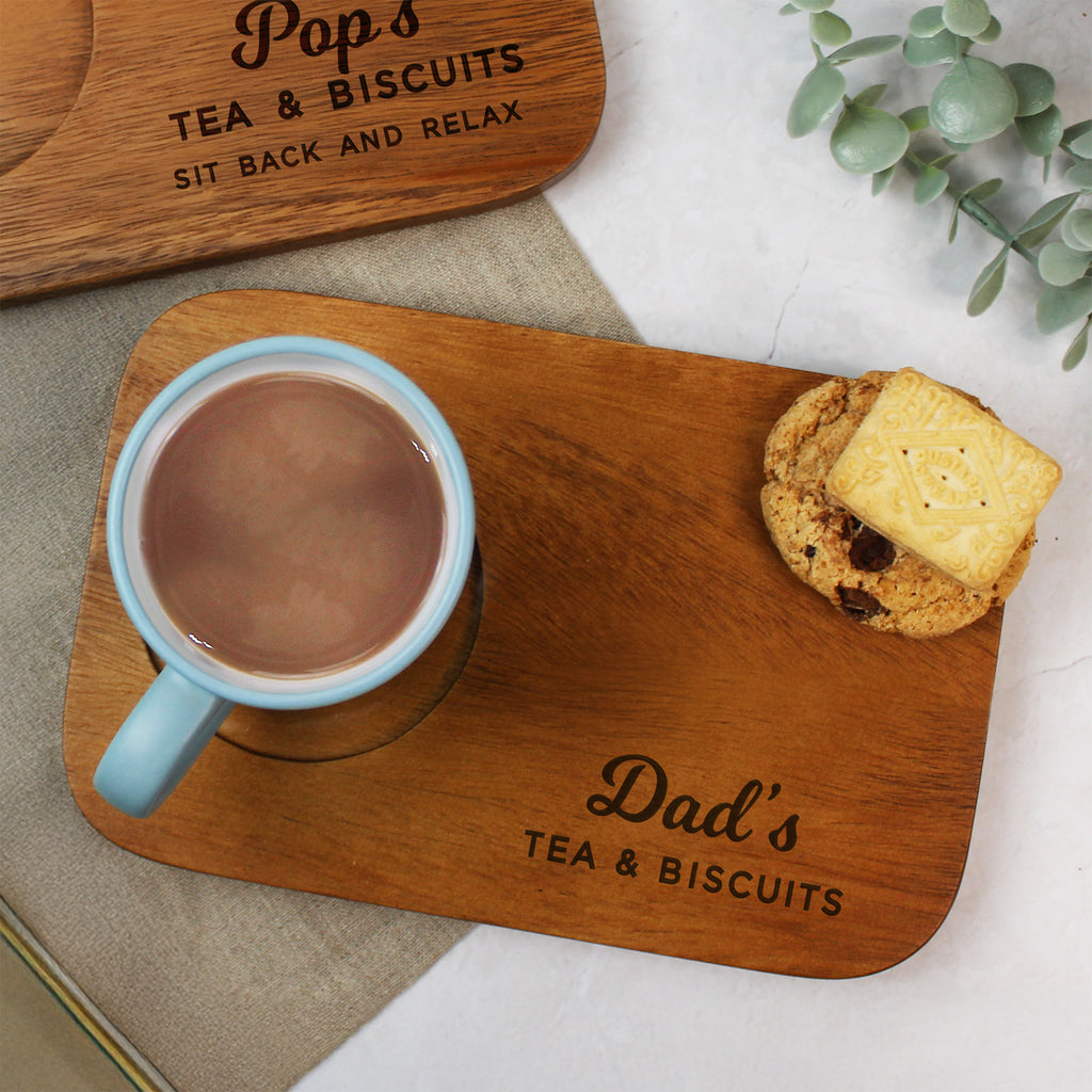 Wooden tray with a mug of tea and a biscuit, engraved with 'Dad's Tea & Biscuits'.