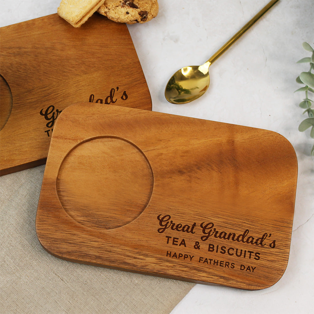 Wooden coaster with engraved text on a marble surface
