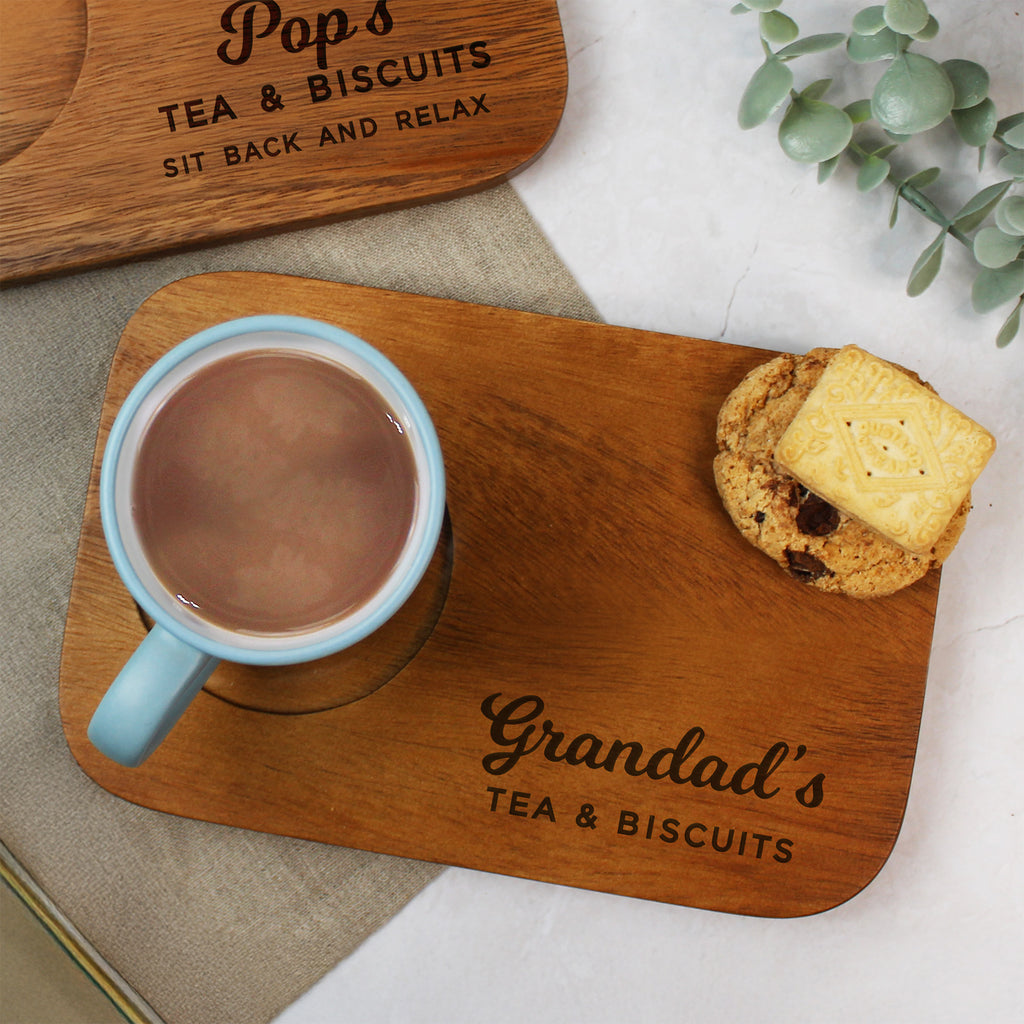 Wooden board with a mug of tea and a biscuit, branded 'Grandad's Tea & Biscuits'.