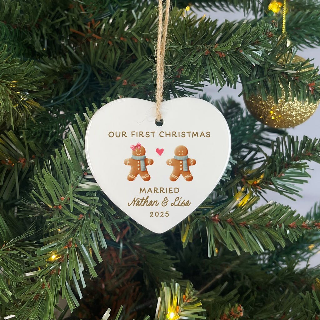 Heart-shaped ornament with gingerbread men on a Christmas tree