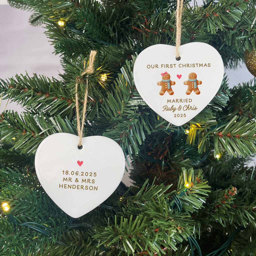 Heart-shaped ornaments on a Christmas tree with personalized text and gingerbread men illustrations.